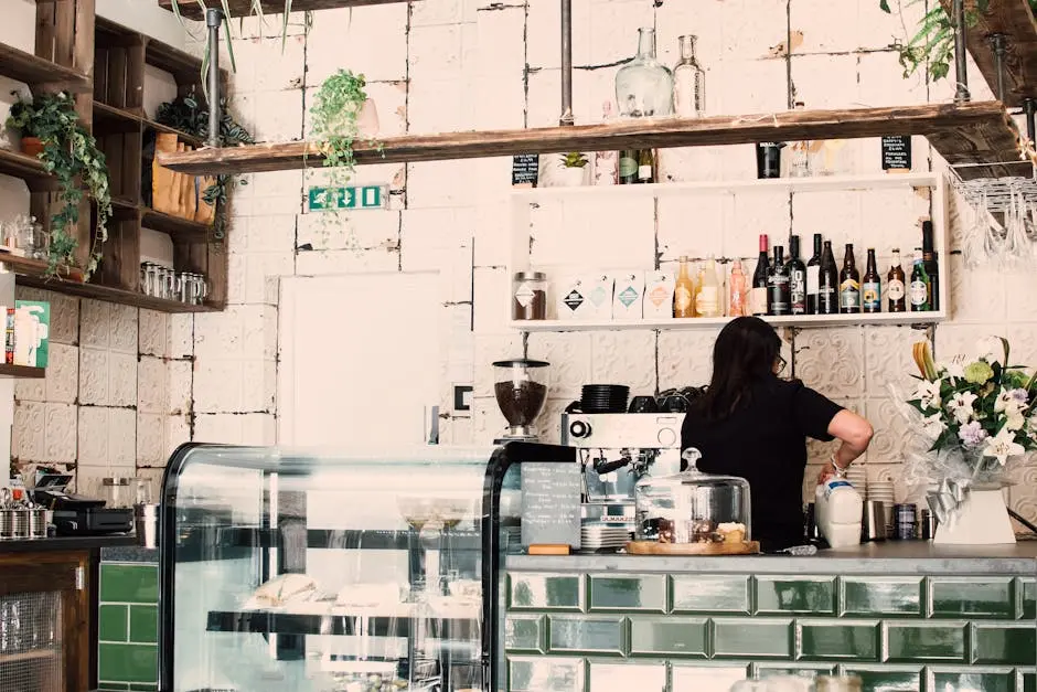 Charming café interior showcasing a barista preparing coffee behind the counter.