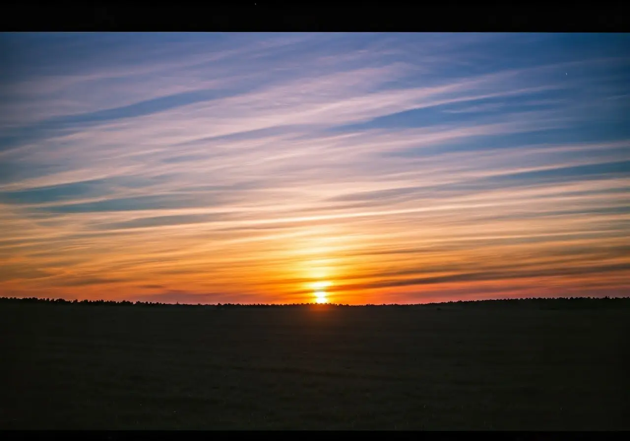 Sunset over peaceful, serene landscape with colorful sky. 35mm stock photo