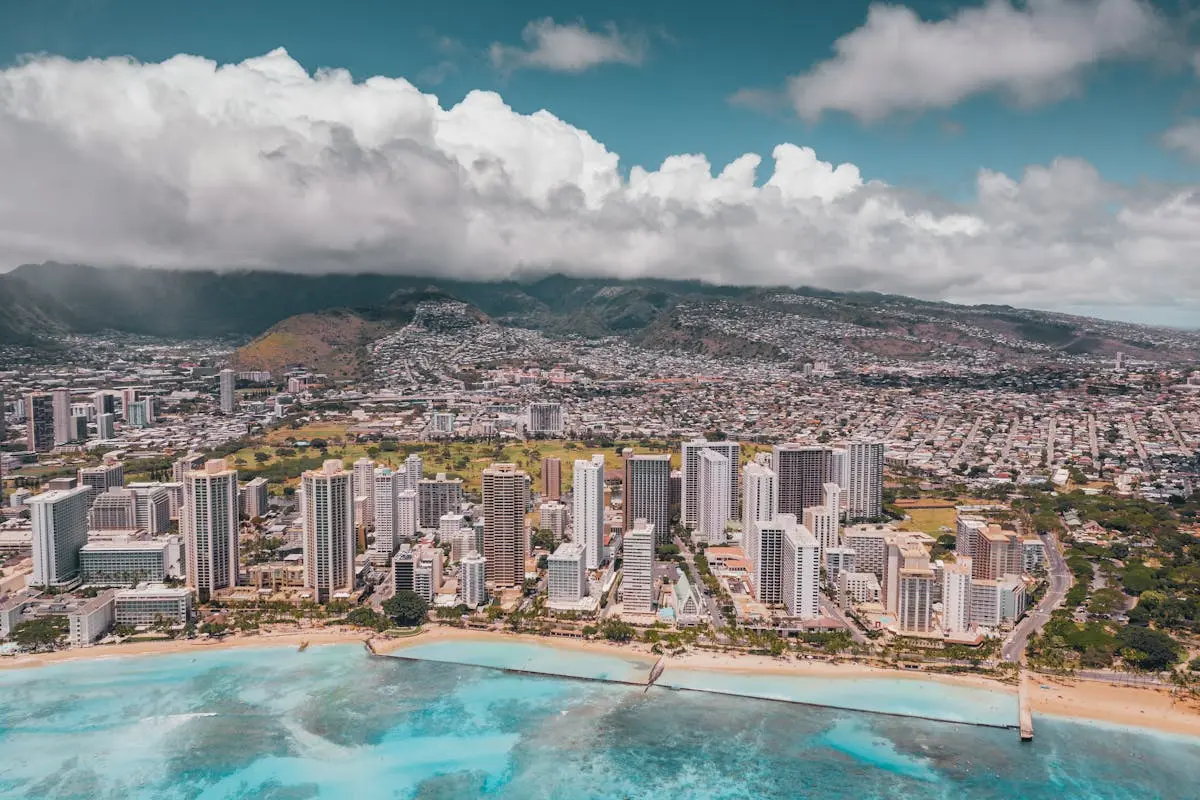 A breathtaking aerial view of Honolulu’s cityscape and beach coastline.