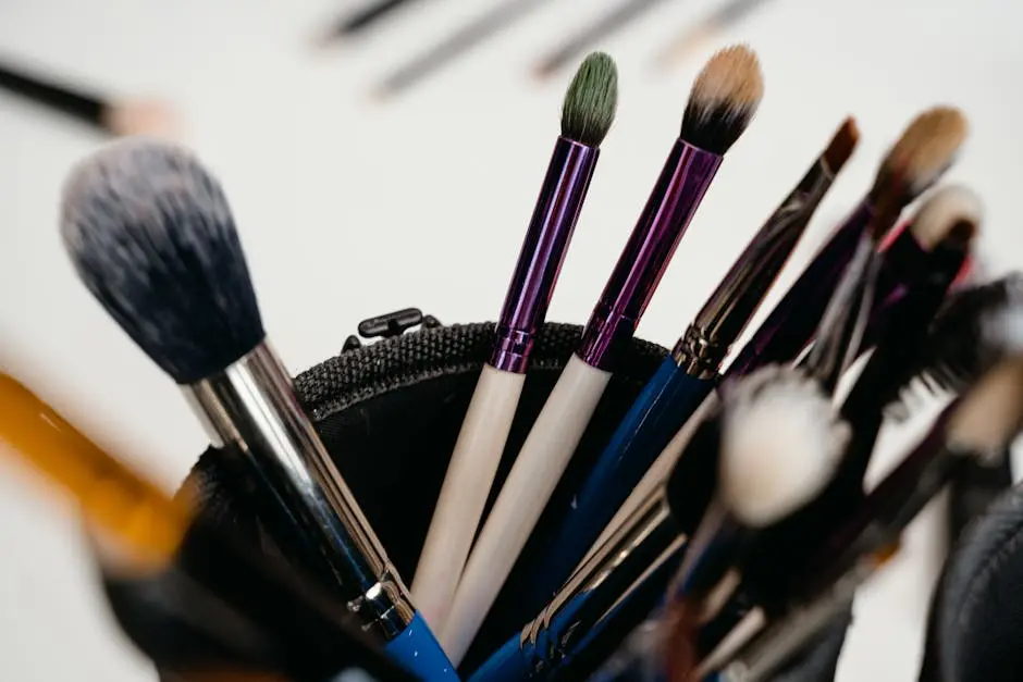 A close-up view of various makeup brushes arranged in a holder, ideal for beauty products and cosmetics themes.