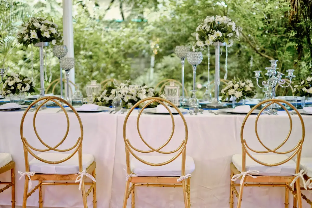 Three Yellow Padded Chairs Beside Table