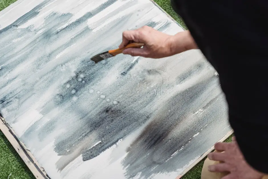 Close-up of an abstract painting process using brush techniques for unique artistic effects.