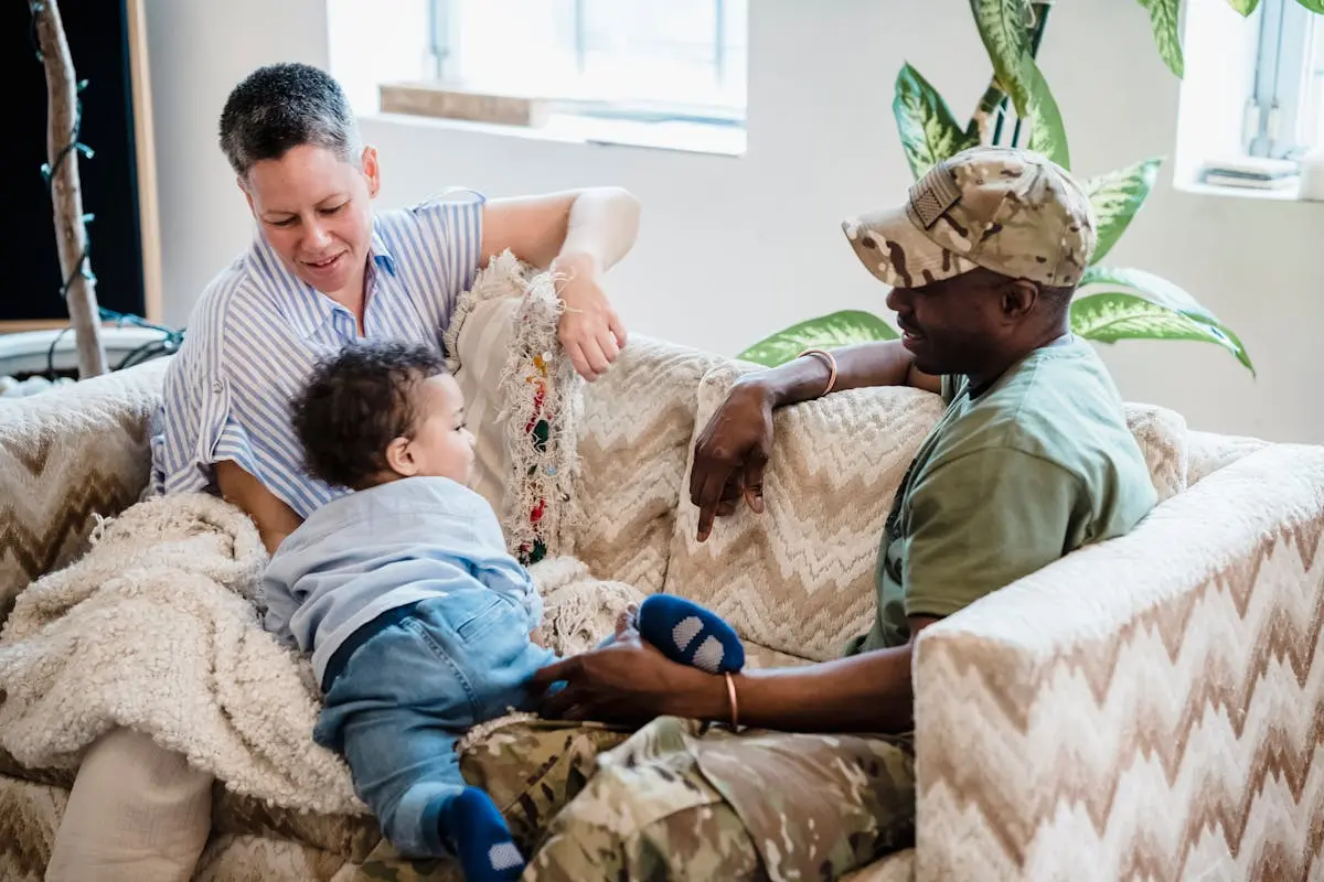 Happy multiracial family enjoying quality time together on a sofa in their cozy home.