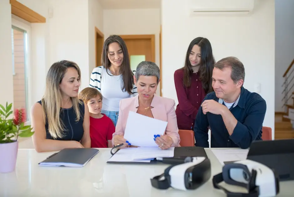 A family meeting with a female realtor reviewing documents in a bright, modern room.