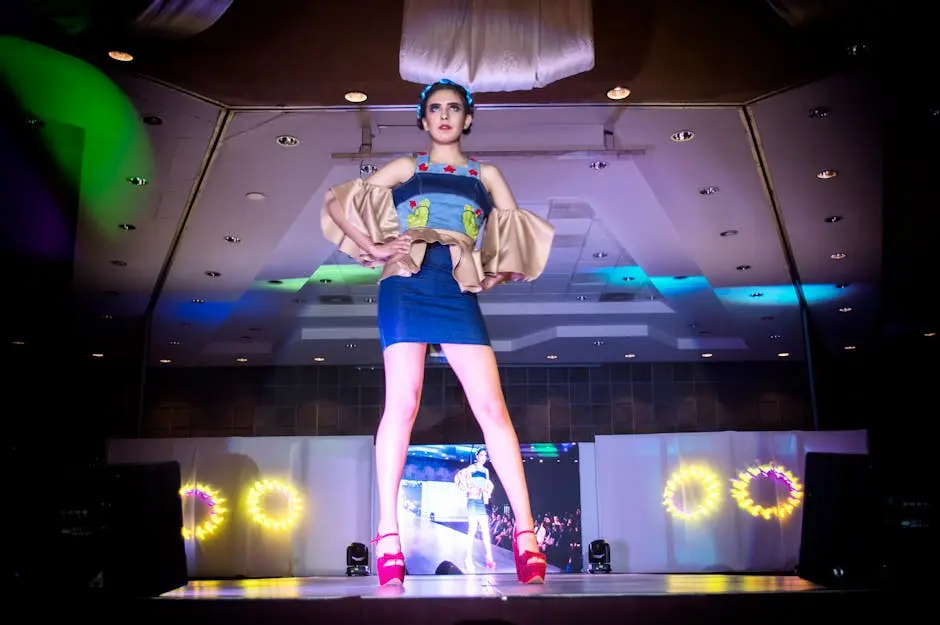 Fashion model on stage in a colorful outfit during a runway show in Morelia, Mexico.