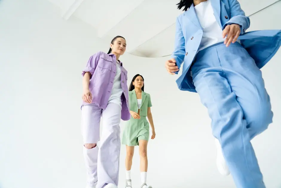 Low Angle Shot of Young Women in Trendy Pastel Outfits