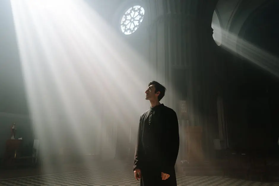 A Priest in Cassock Standing while Looking Up