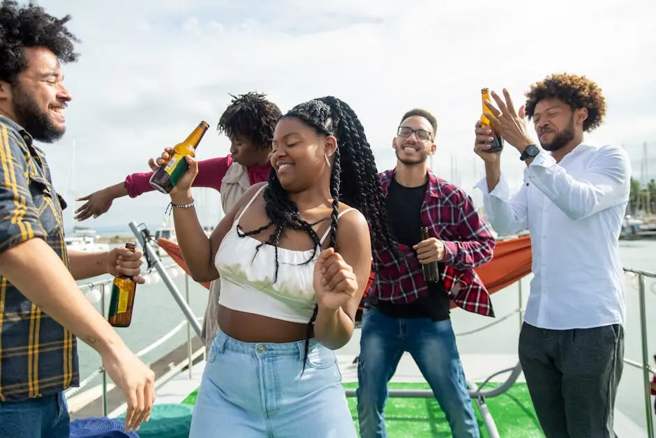 Friends enjoying a party on a yacht with drinks and dancing outdoors in Portugal.