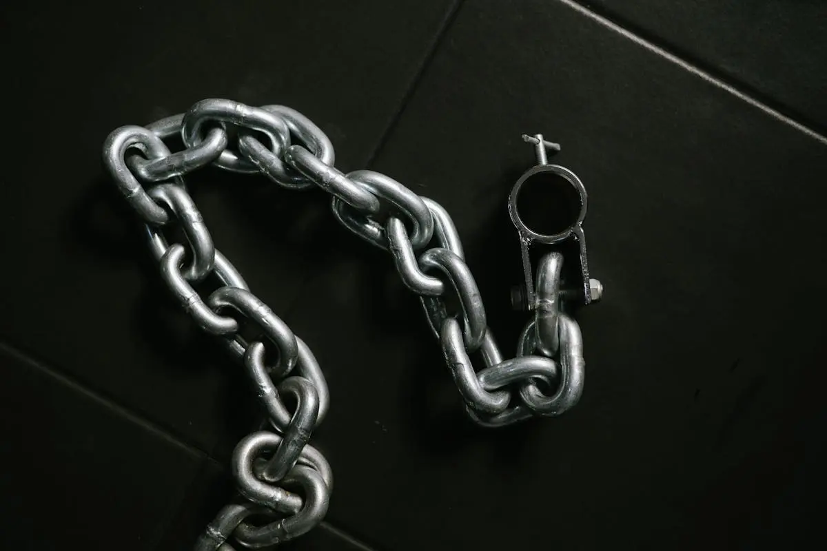 Close-up of a Thick Chain Lying on the Floor 