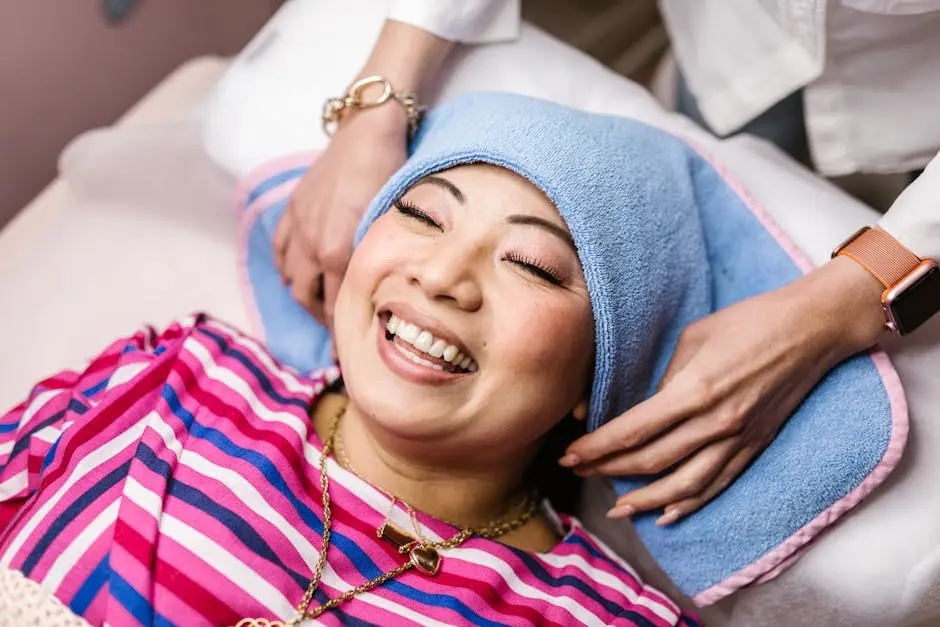 A Woman Smiling while Lying on the Spa Bed