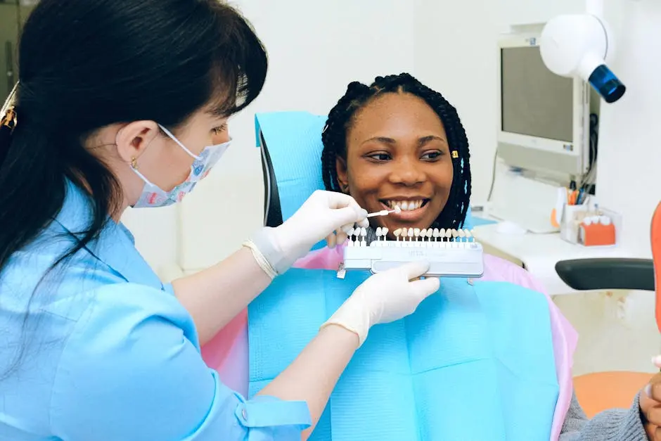 Dentist consults patient with teeth color samples in a modern dental clinic.