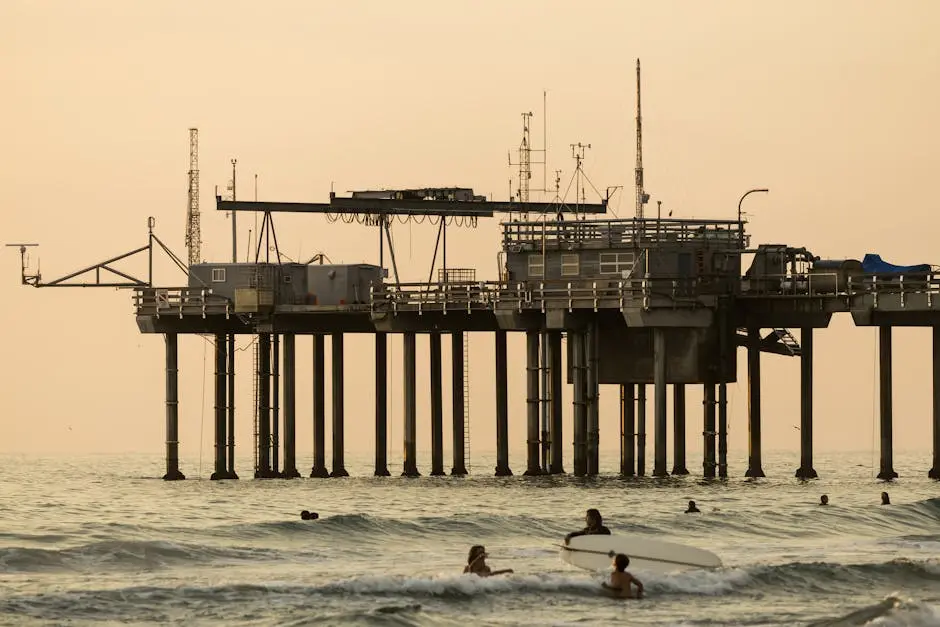 Surfers Near Ocean Research Pier at Sunset