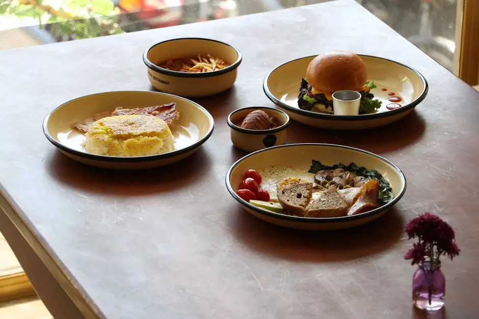 A variety of plated foods on a table in a cozy restaurant setting.