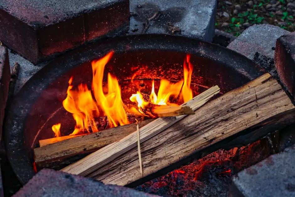 Vibrant flames burning wood in a fire pit surrounded by bricks outdoors.