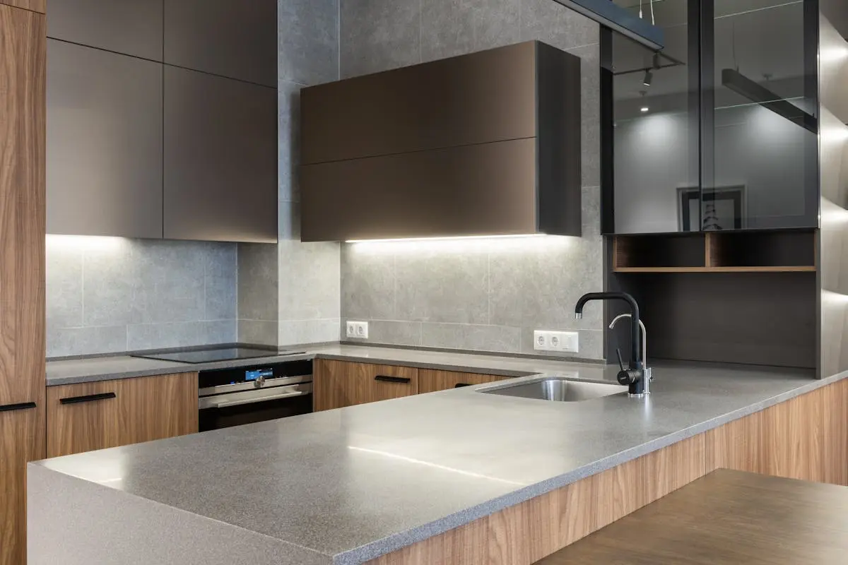 Sleek and modern kitchen with contemporary appliances and wooden cabinetry.