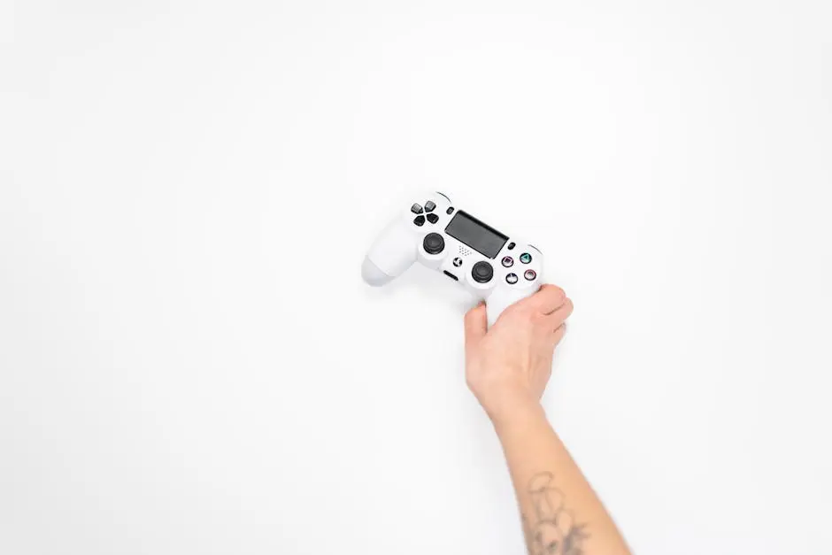 A white gaming controller held by a hand against a minimal white background, perfect for tech and gaming themes.