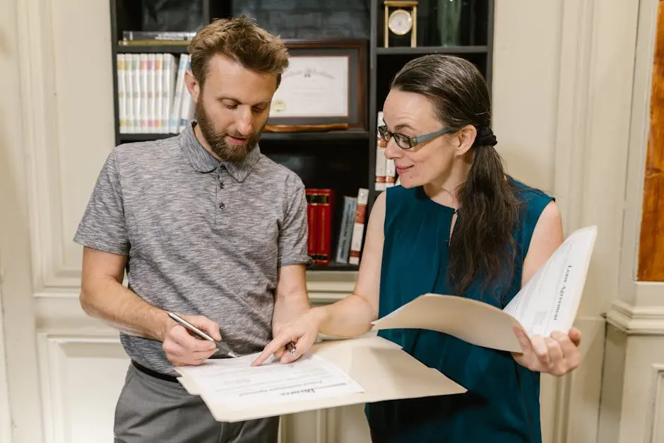 Man in Gray Crew Neck Shirt Holding White Paper