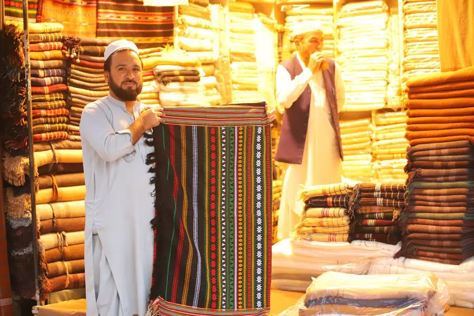 Vibrant market scene with traditional rugs and textiles on display at a cultural bazaar.