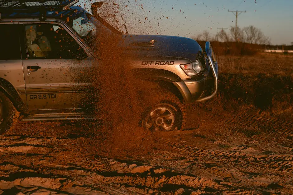 Powerful 4x4 SUV conquering a sandy trail, showcasing thrilling off-road action and adventure.