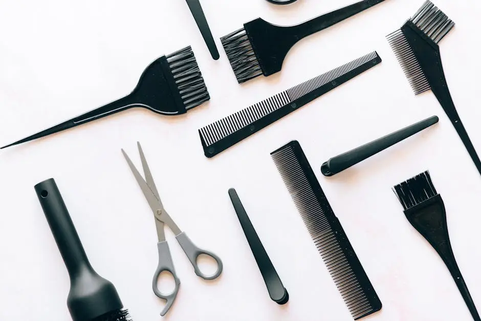 Top View of a Set of Hairdressers Tools on White Surface