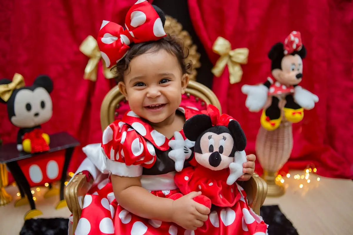 a girl playing with her Disney cute stuffed animals