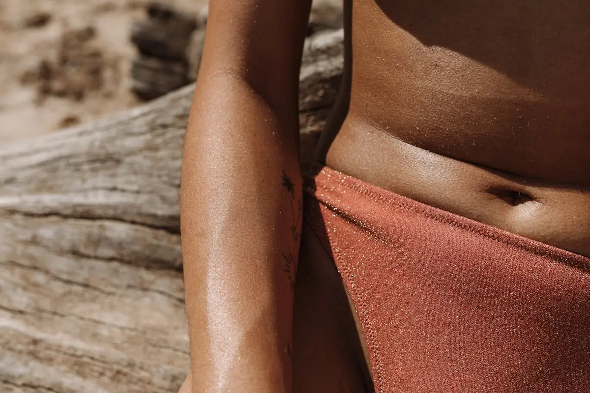 Close-Up Shot of Tattooed Woman Wearing Swimsuit 