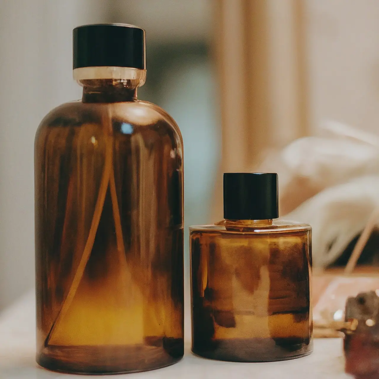 Close-up of luxury fragrance oil bottles on a vanity. 35mm stock photo