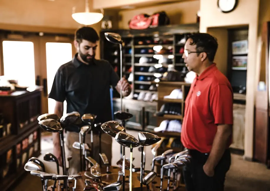 Man Standing Beside Man Holding Gray Golf Club