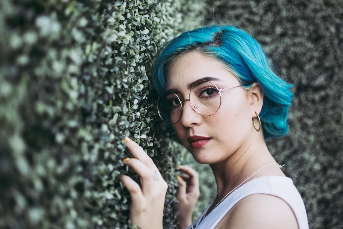 Close-Up Photo of Woman Leaning On Bush