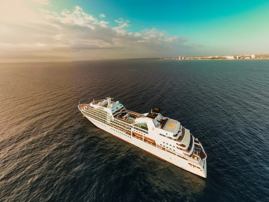 Aerial view of modern white cruise ship sailing on rippling sea water against cloudy sunset sky