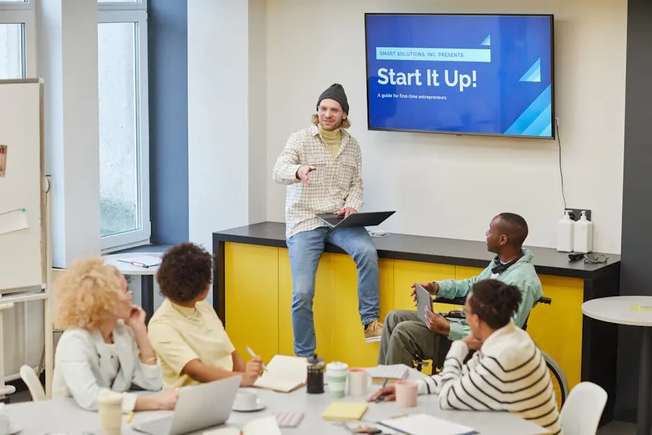 A diverse group in an office meeting discussing startup strategies and innovative ideas.