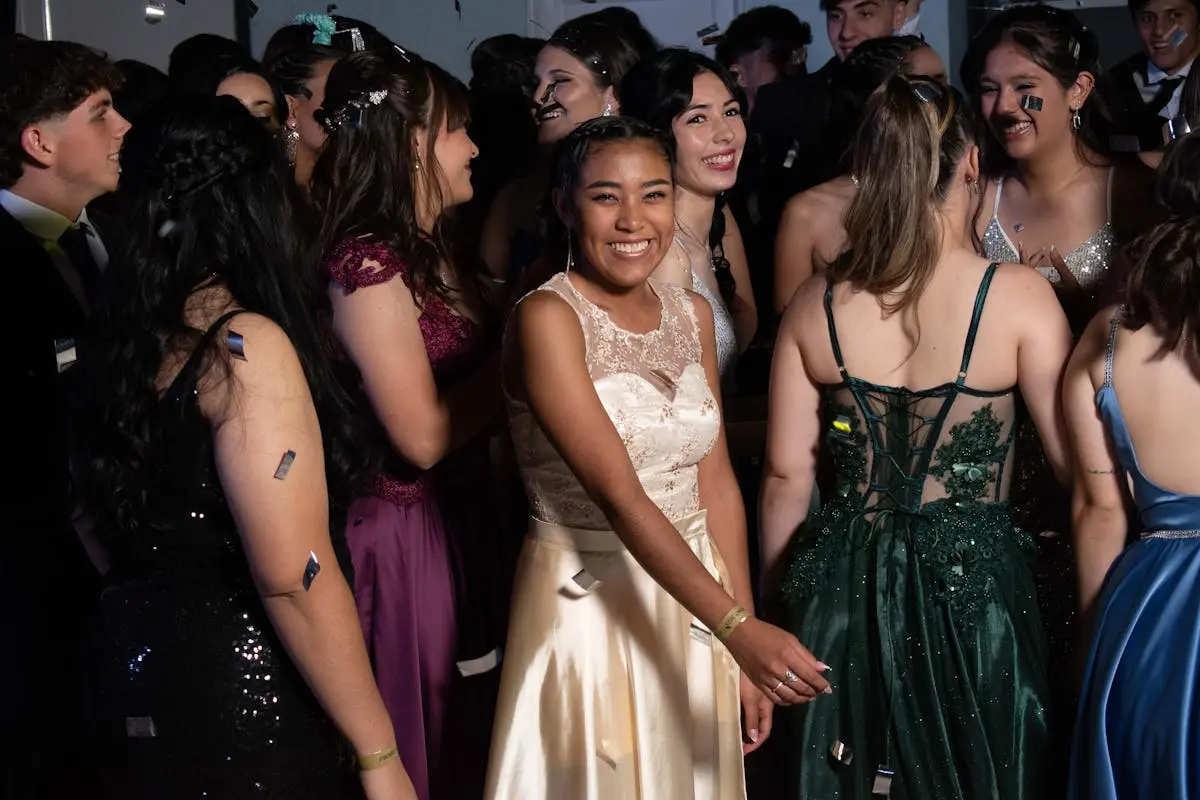 Teenage Boys and Girls in Evening Dresses at a Prom Party 