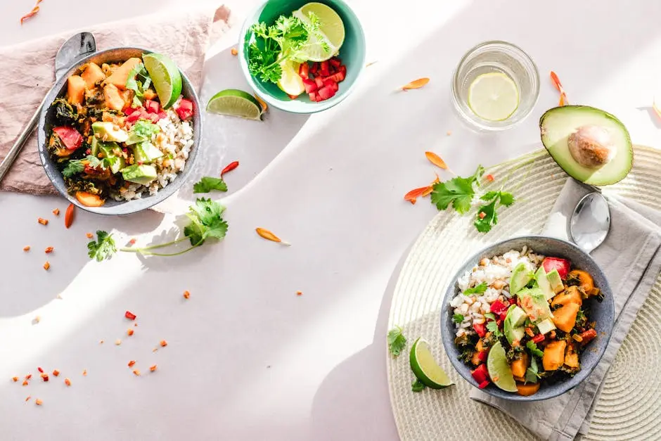 Top-down view of vibrant vegan bowls filled with fresh vegetables, perfect for a healthy meal.