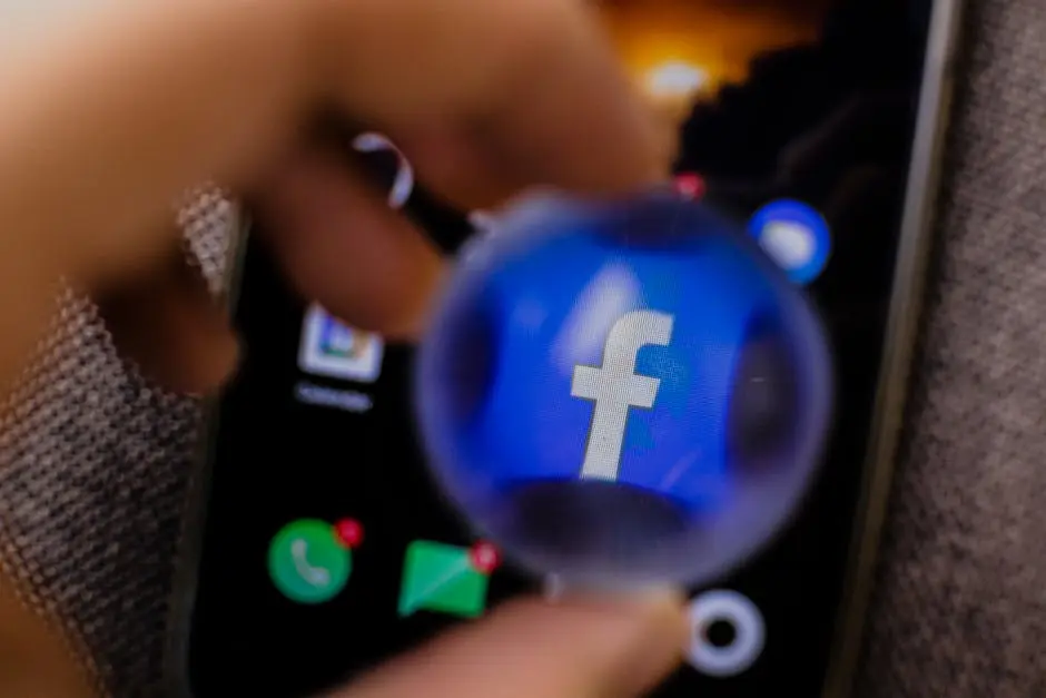 Close-up view of the Facebook app icon magnified on a smartphone screen.