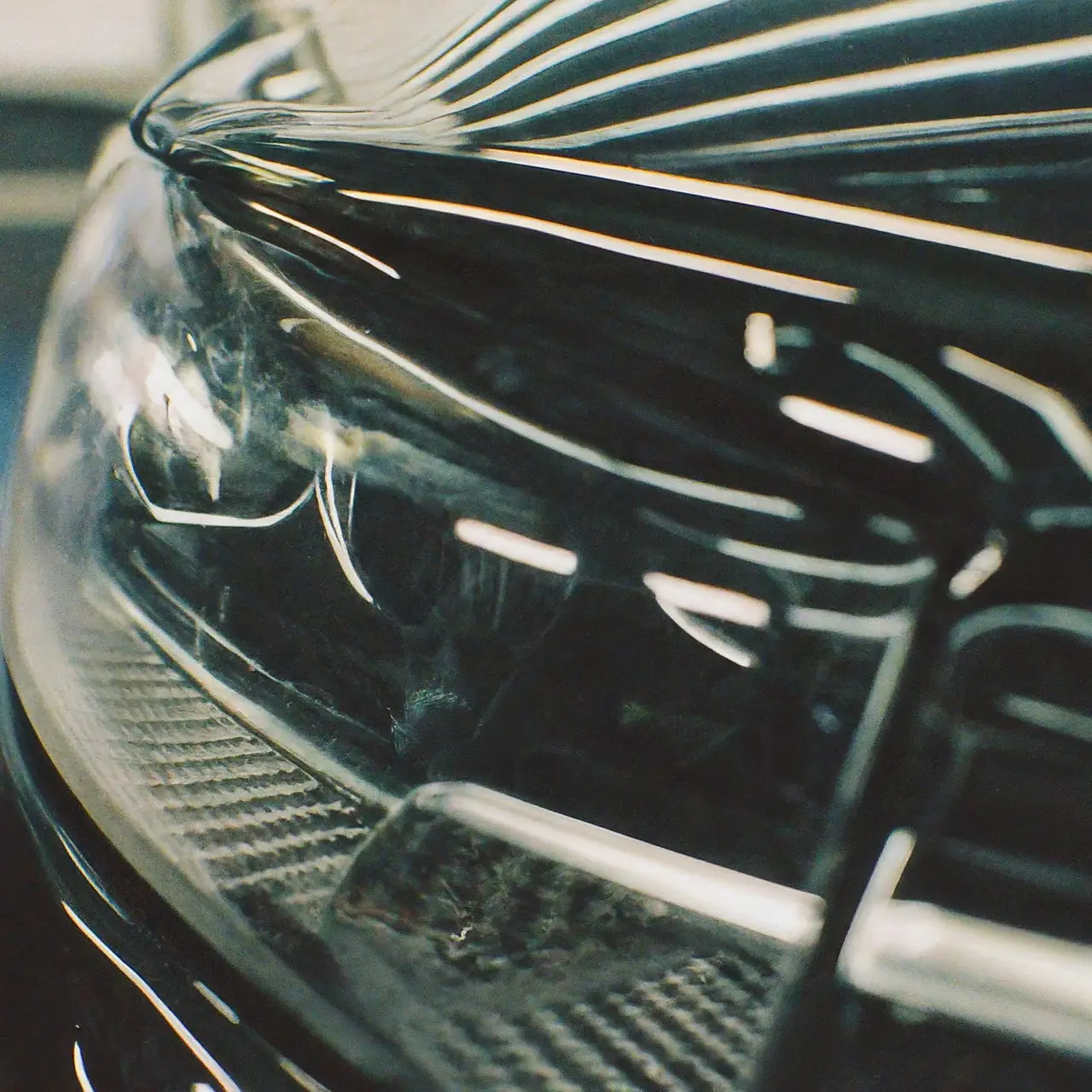 A sparkling, freshly detailed car in a workshop. 35mm stock photo