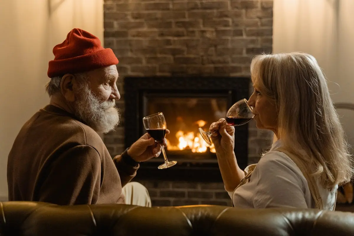 Man and Woman Holding Wine Glasses