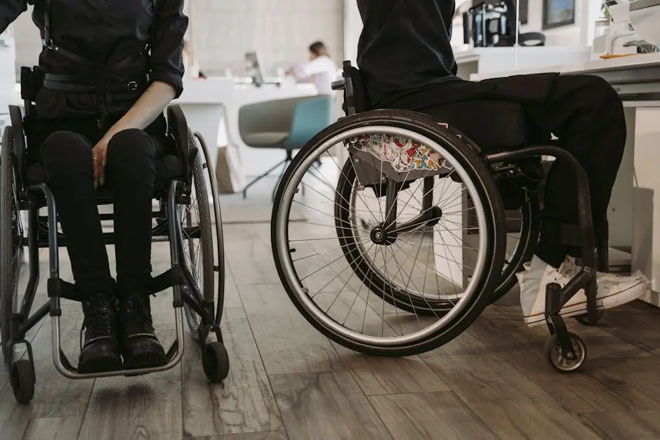 Person in Black Pants and Black Shirt Sitting on Wheelchair