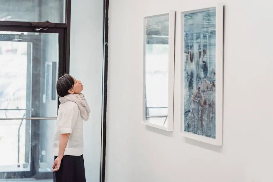 A woman observing abstract paintings in a modern art gallery setting.