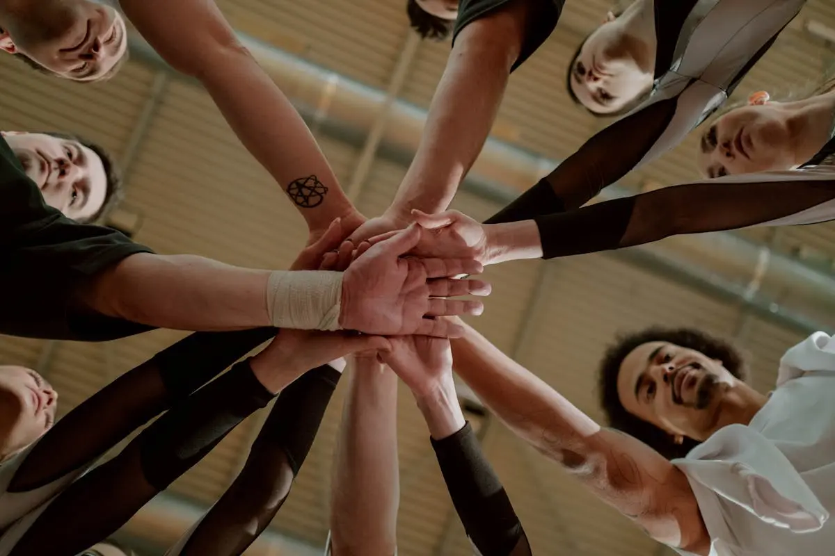 Group of People Joining Hands Together