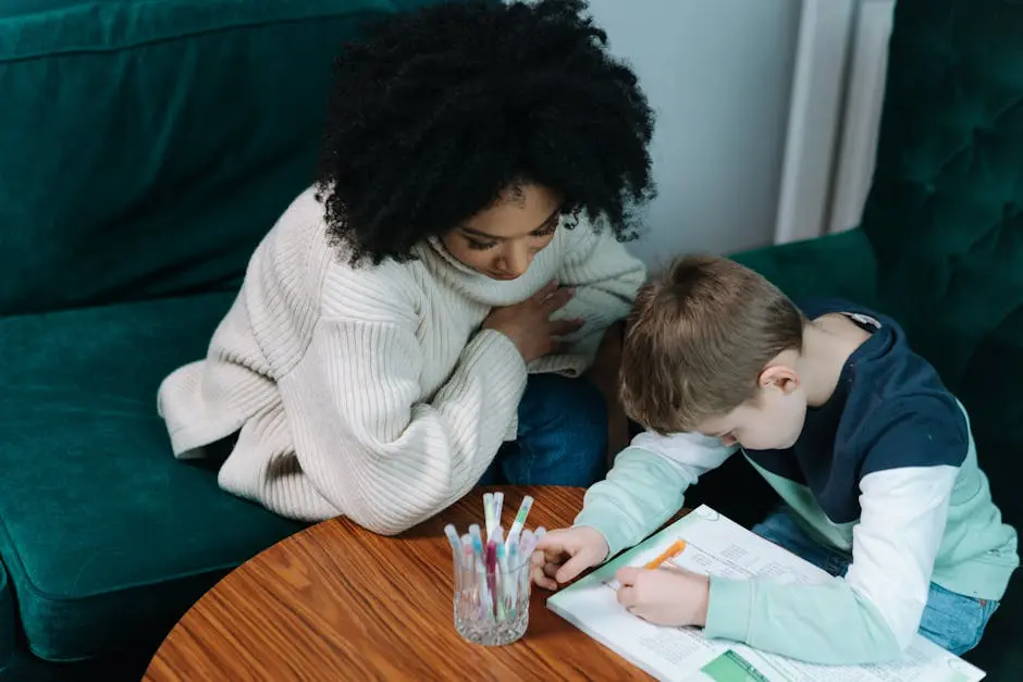 A child being tutoring at home, writing in a notebook while seated on a green couch.