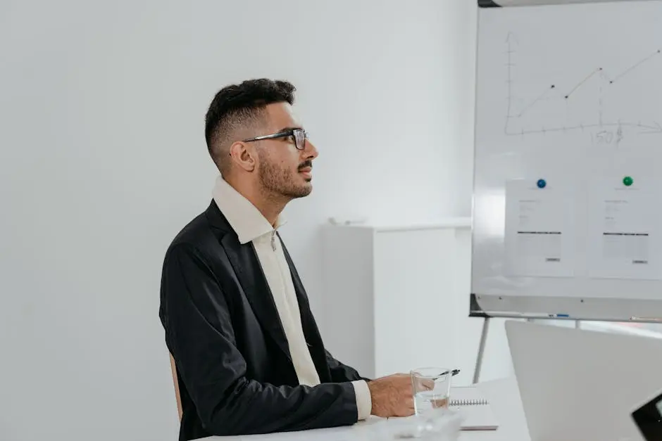 Man in Black Suit Jacket Wearing Eyeglasses