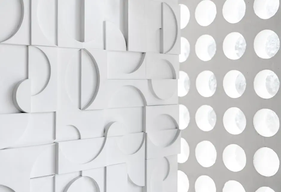 Abstract white wall design featuring geometric shapes and circular patterns, perfect for contemporary spaces.