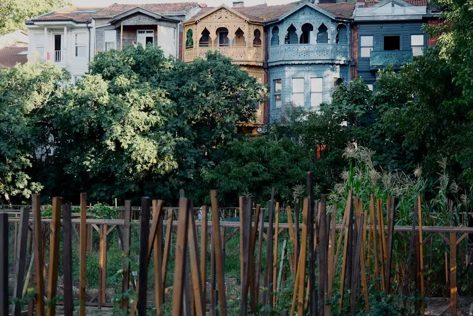 Charming 19th-century wooden townhouses with vibrant facades in a lush urban garden, Istanbul.