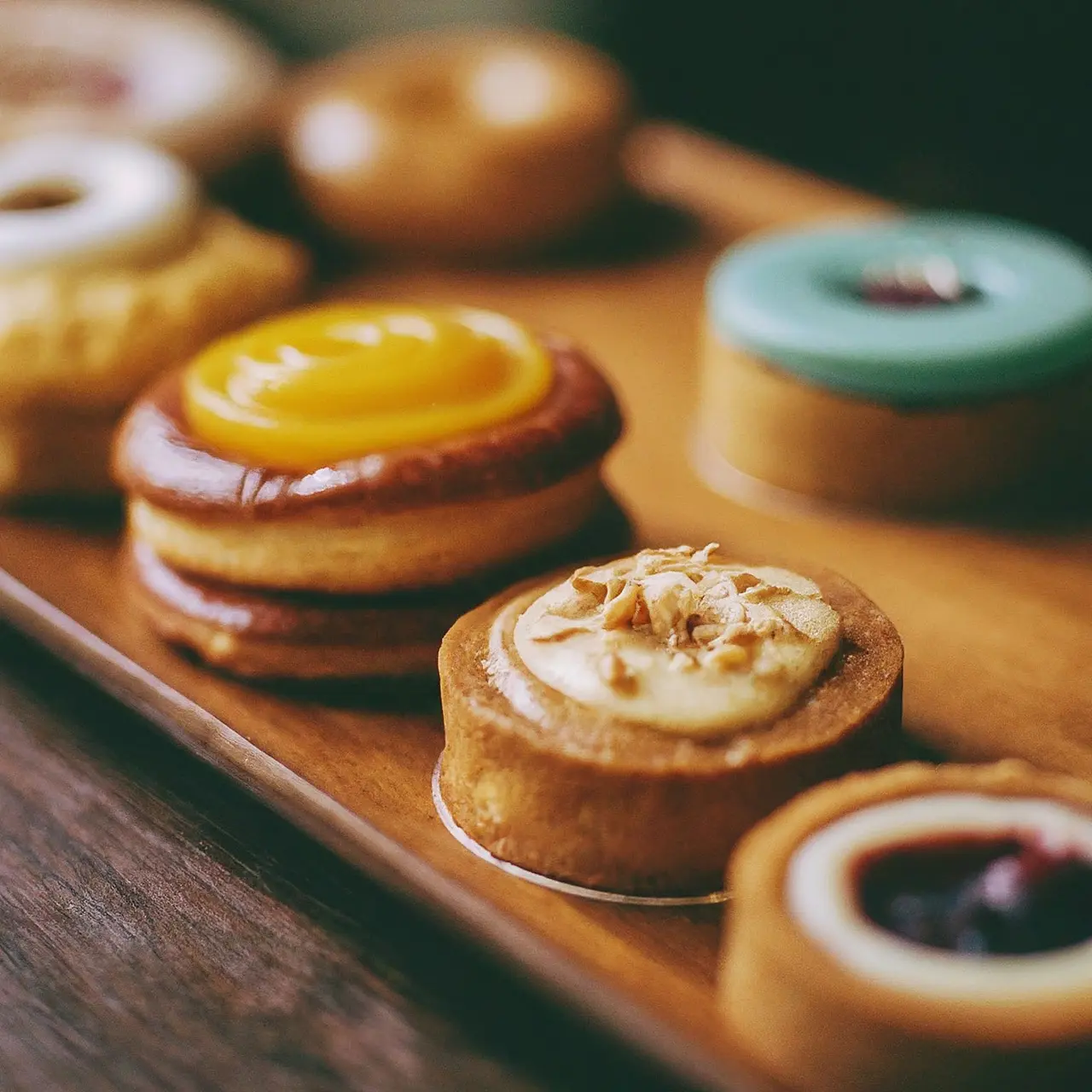 A variety of colorful nut-free pastries on display. 35mm stock photo