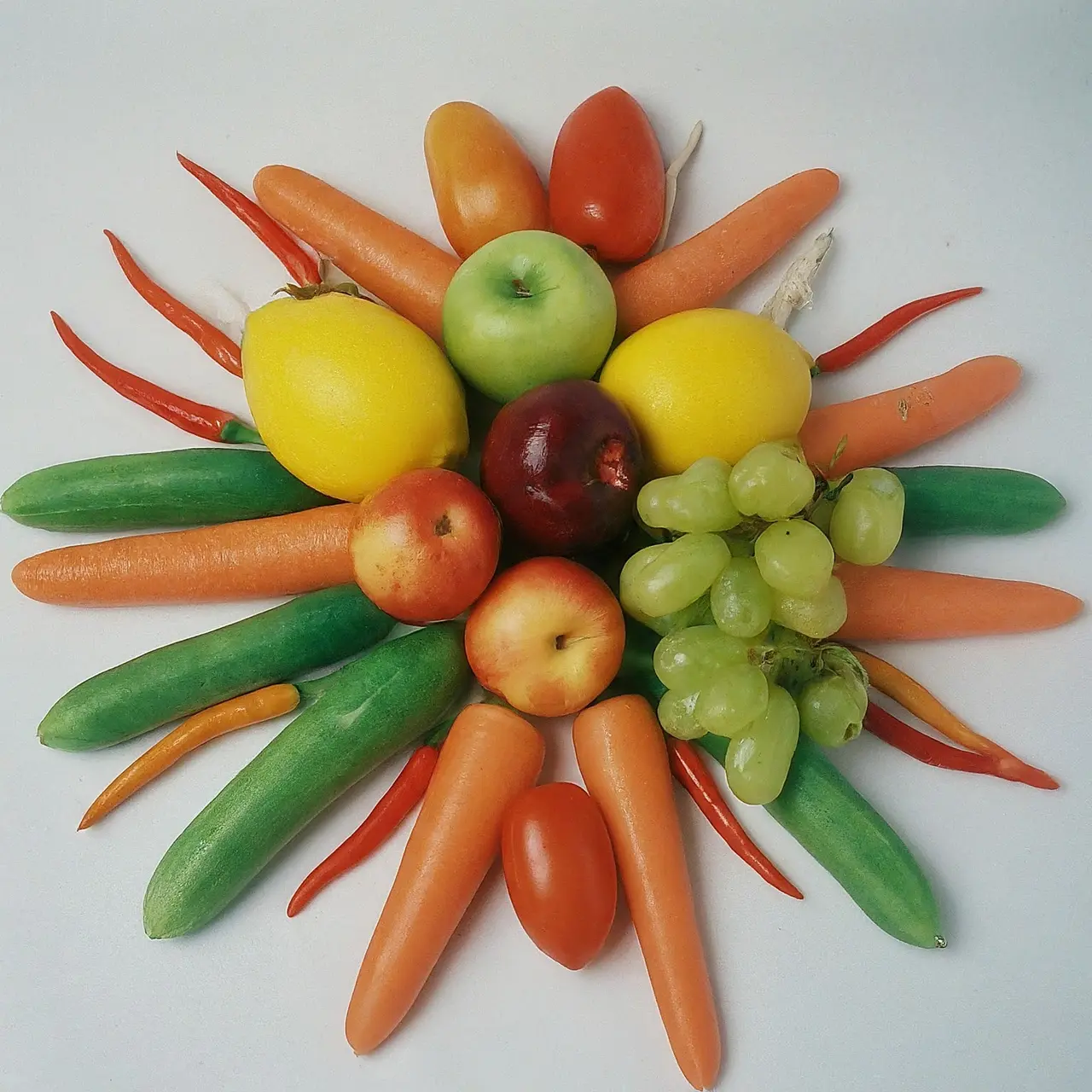 Fresh vegetables and fruits arranged artistically on a white background. 35mm stock photo