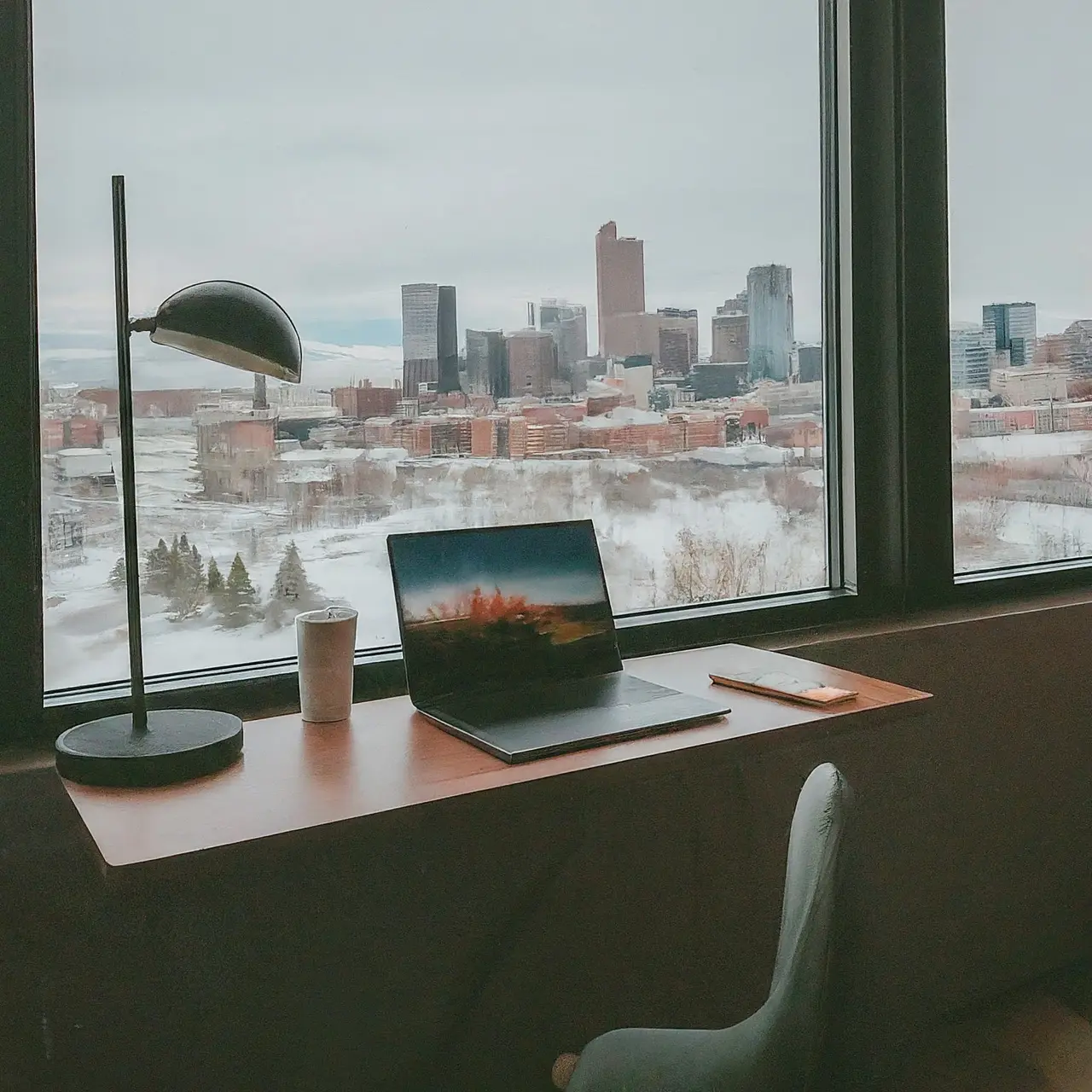 A stylish standing desk by a window overlooking Denver cityscape. 35mm stock photo