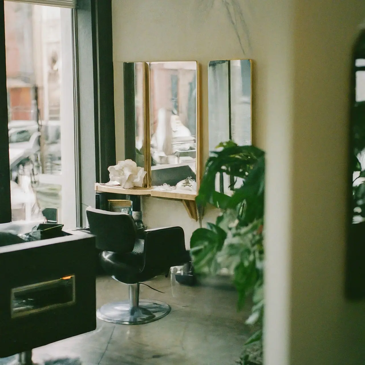 A chic hair salon with stylish decor and mirrors. 35mm stock photo