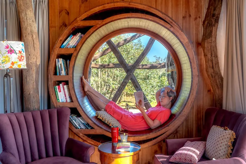 A woman reading in a circular window seat