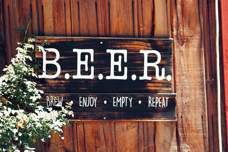 Rustic wooden sign with B.E.E.R. stands for Brew, Enjoy, Empty, Repeat.