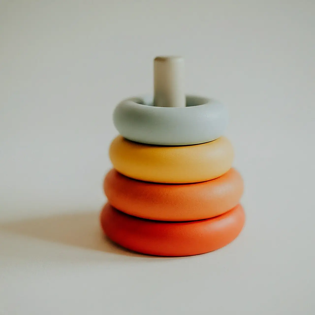 Colorful baby stacking rings on a white background. 35mm stock photo